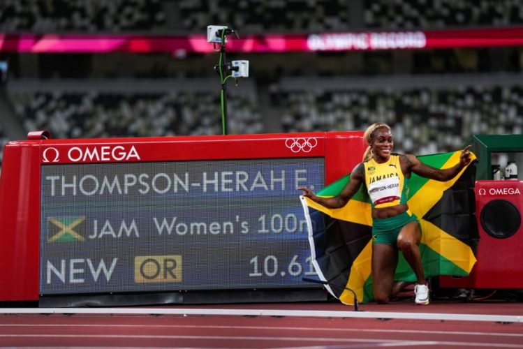 31_thompson_herah_leads_jamaica_sweep_retains_olympic_100m.jpg